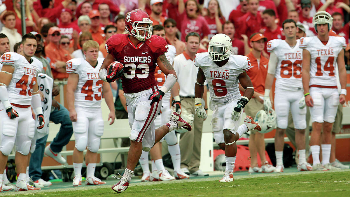 Trey Millard cruises down the Texas sideline after busting through two tacklers in the second quarter in the UT Oklahoma in the Red River Rivalry at the Cotton Bowl on October 13, 2012.