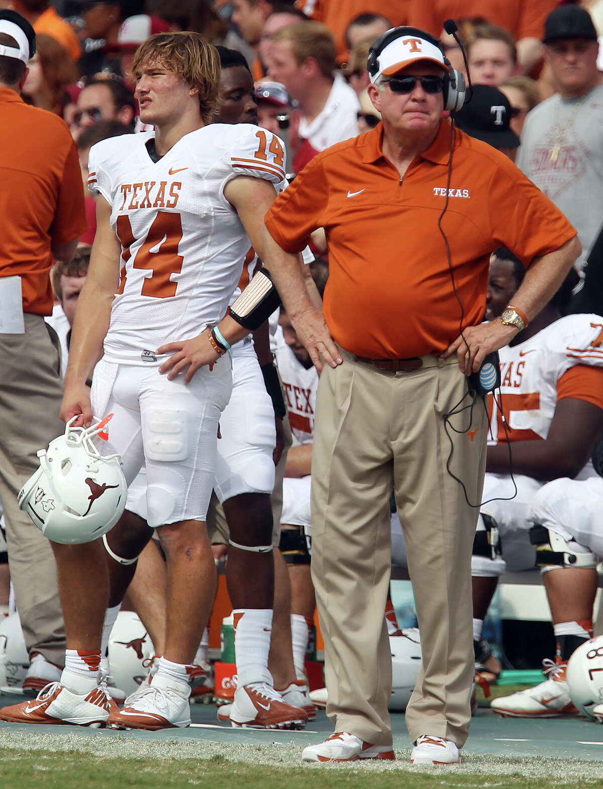 Texas Longhorns head coach Mac Brown (right) and quarterback David Ash (left) had difficulty finding a solution against the Oklahoma Sooners in the second half at the Red River Rivalry at the Cotton Bowl in Dallas on Saturday, Oct. 13, 2012. The Sooners defeated the Longhorns 63-21.