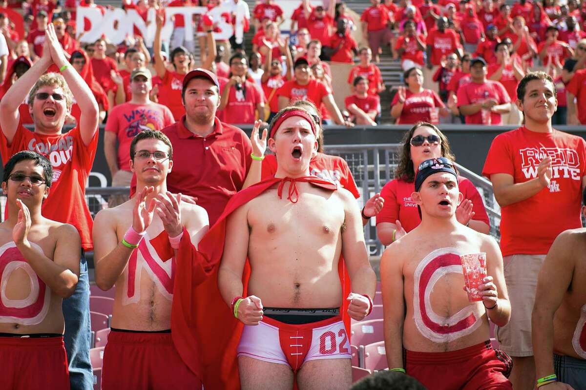 Houston fans cheer the opening kickoff of a college football game against UAB at Robertson Stadium, Saturday, Oct. 13, 2012, in Houston.