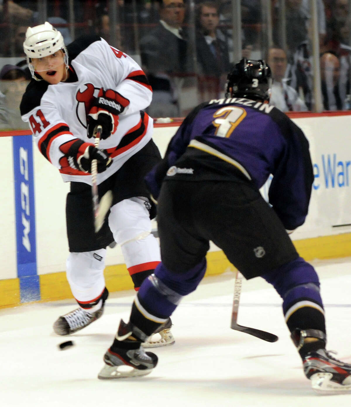 Albany Devil's Raman Hrabarenka (41), left, shoots the puck, and sets up a first-period goal, as Manchester Monarch's Jake Muzzin (3) defends during their hockey game on Saturday, Oct. 13, 2012, at Times Union Center in Albany, N.Y. (Cindy Schultz / Times Union)