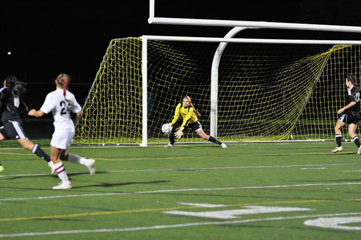 Fairfield Warde goalkeeper Katie Brennan scoops up a save during the Mustangs' 1-0 win over Trumbull on Thursday in Trumbull.