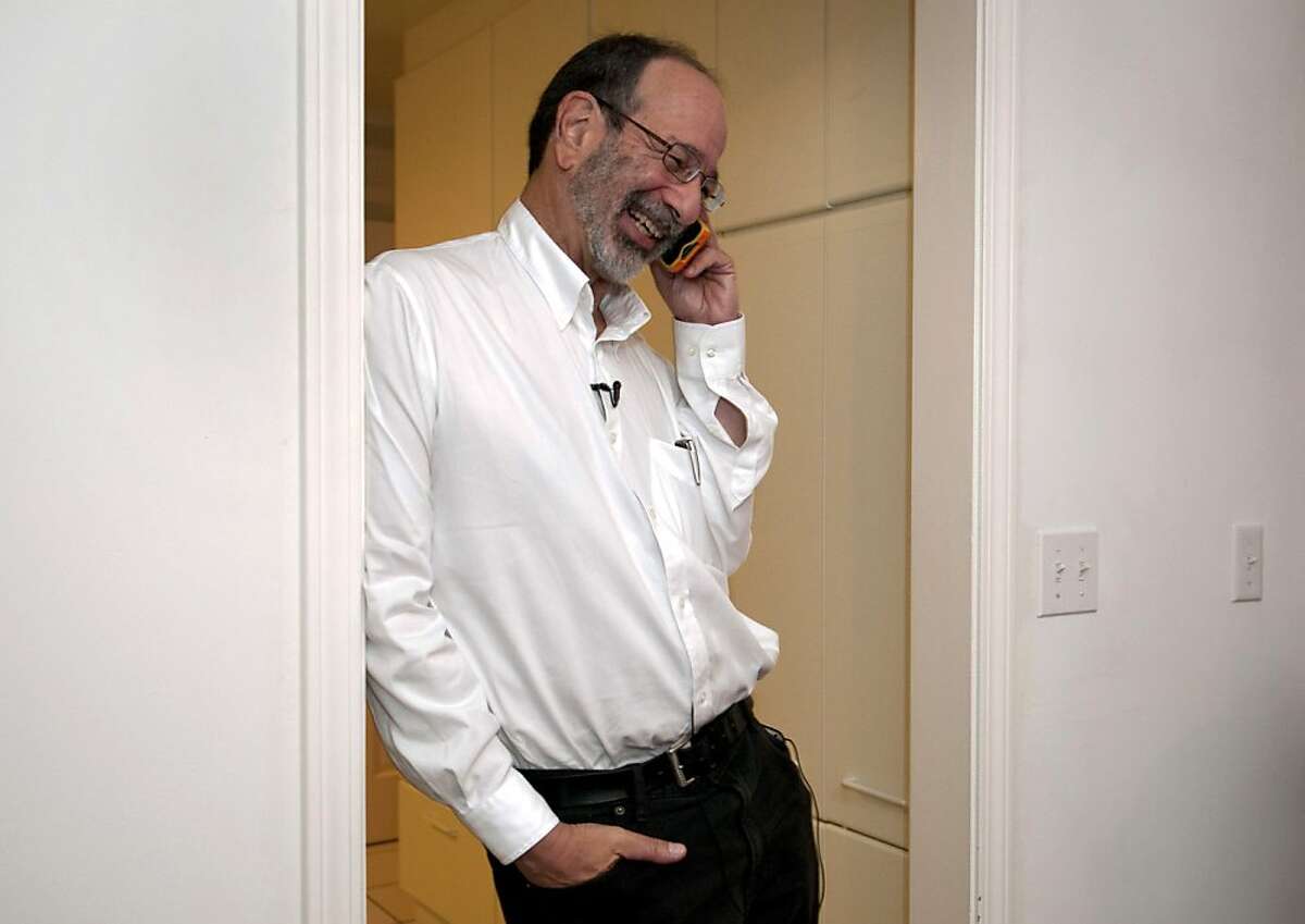 This photo provided by Stanford News Service, shows Alvin Roth taking a phone call, after being awarded the Nobel economics prize, at his home in Menlo Park, Calif. on Monday, Oct. 15, 2012. Roth, 60, and Lloyd Shapley, 89, two American scholars, were awarded the Nobel economics prize on Monday, for studies on the match-making that takes place when doctors are coupled up with hospitals, students with schools and human organs with transplant recipients. The work of Roth and Shapley has sparked a flourishing field of research and helped improve the performance of many markets, the Royal Swedish Academy of Sciences said. (AP Photo/ Stanford News Service, Linda A. Cicero) MANDATORY CREDIT