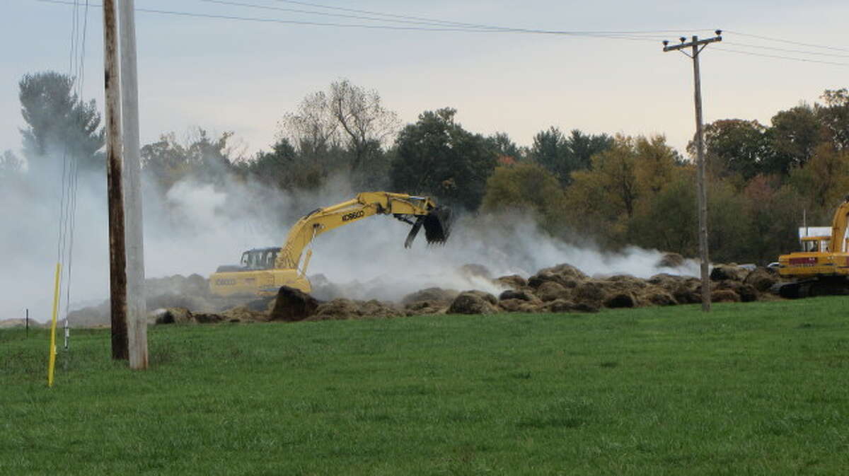 Wind rekindles fire following day