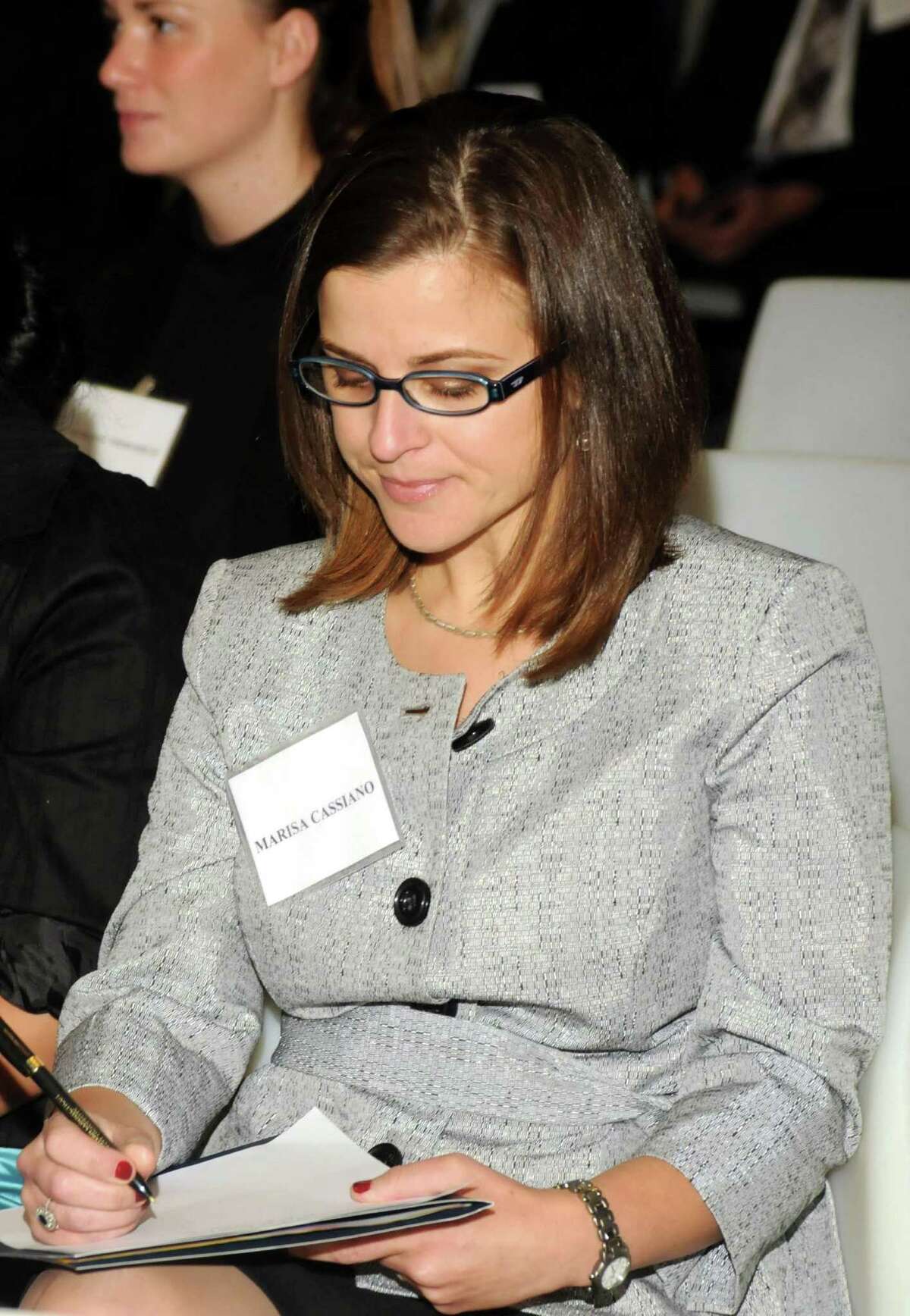 Marissa Cassiano takes notes during a business etiquette dinner that was held at Western Connecticut State University on Tuesday October 9, 2012.
