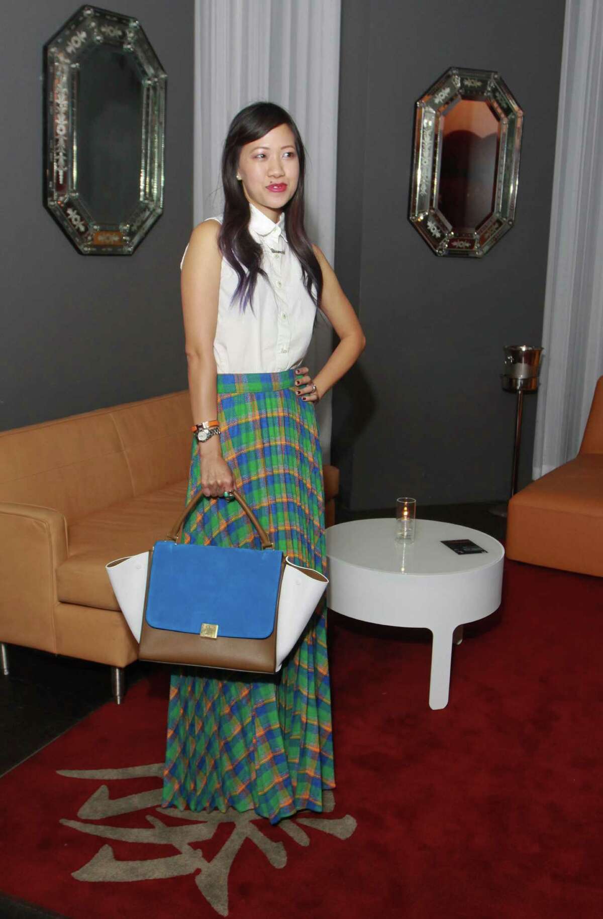 Fashion blogger Issa Chou in a vintage skirt, H&M blouse, Miu Miu strappy platforms and Celine Trapeze handbag.