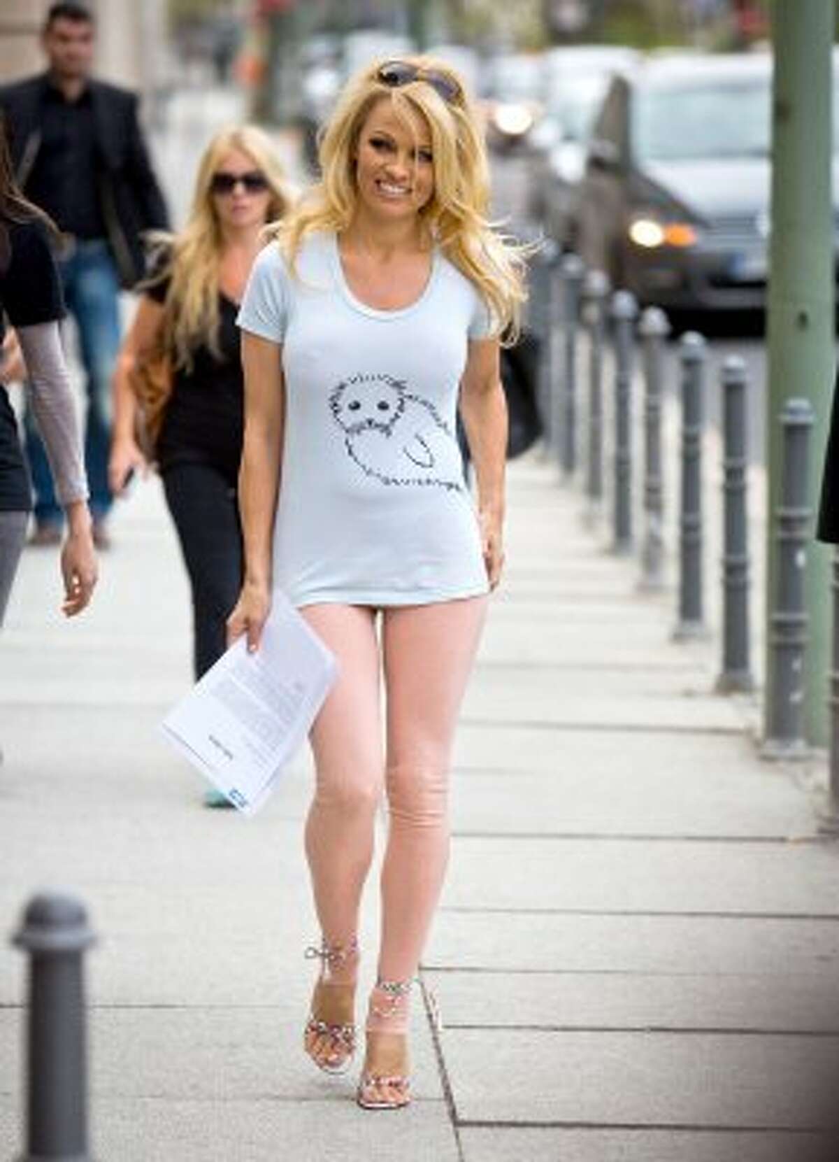 Did Pamela Anderson forget her pants? Or just want to look like she forgot them? She's walking to the German Economy Ministry in Berlin in 2012 to deliver a PETA petition regarding seal skins. (MICHAEL KAPPELER / AFP/Getty Images)