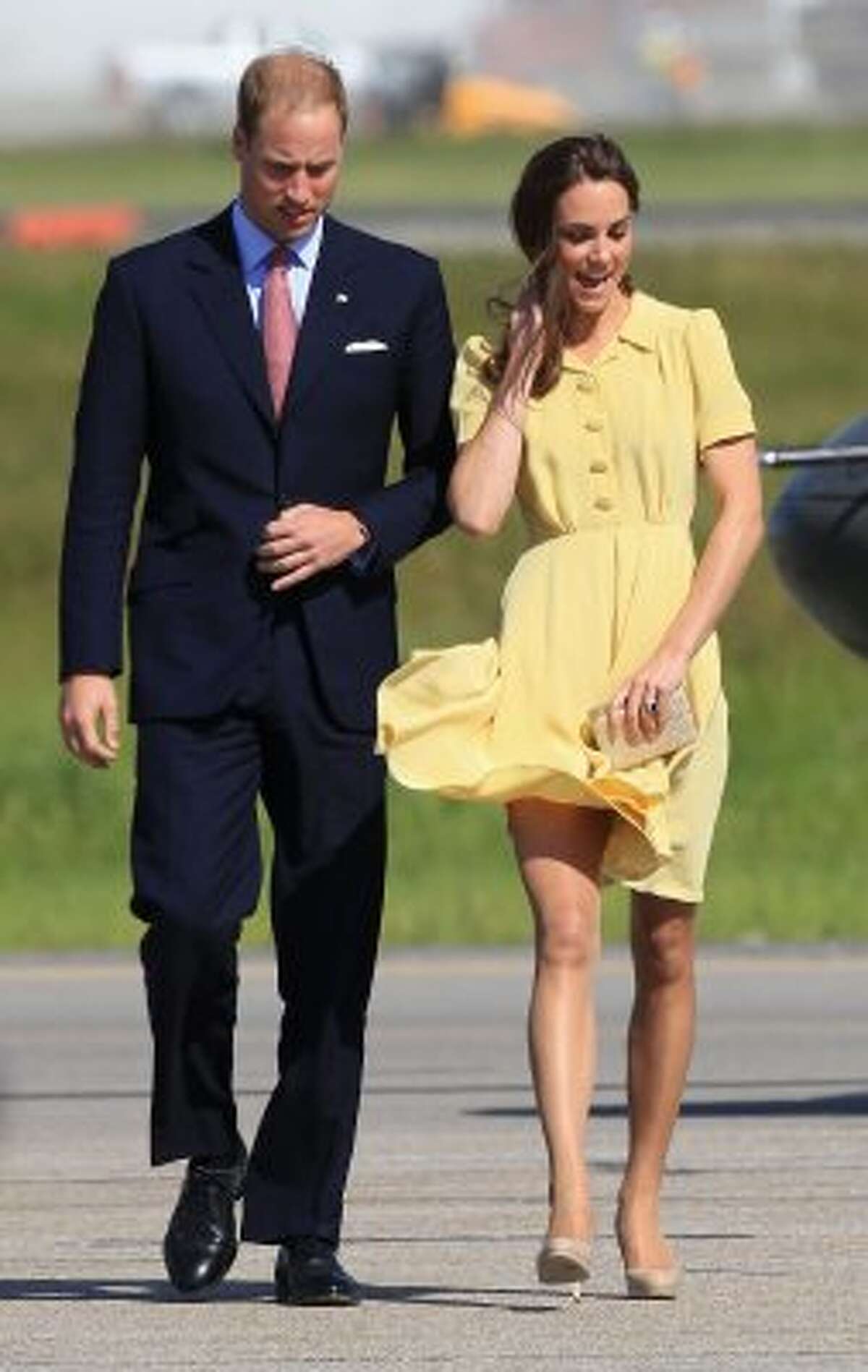 Even Catherine, the Duchess of Cambridge, sometimes has a tough day with clothes, as she struggles with the wind at the Calgary Airport during a visit with Prince William in 2011. (Chris Jackson / Getty Images)