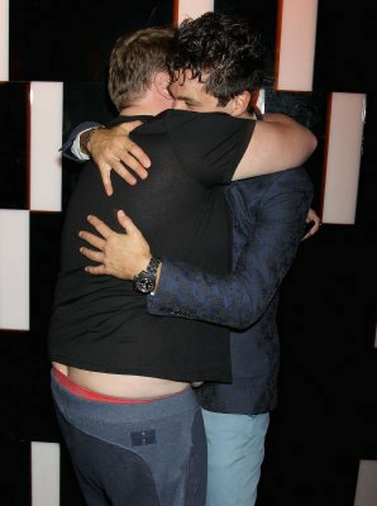 Men have wardrobe malfunctions too. Here's actor James Corden (L) showing some crack while hugging Dominic Cooper at "The Devils Double" afterparty in 2011. (Chris Jackson / Getty Images)