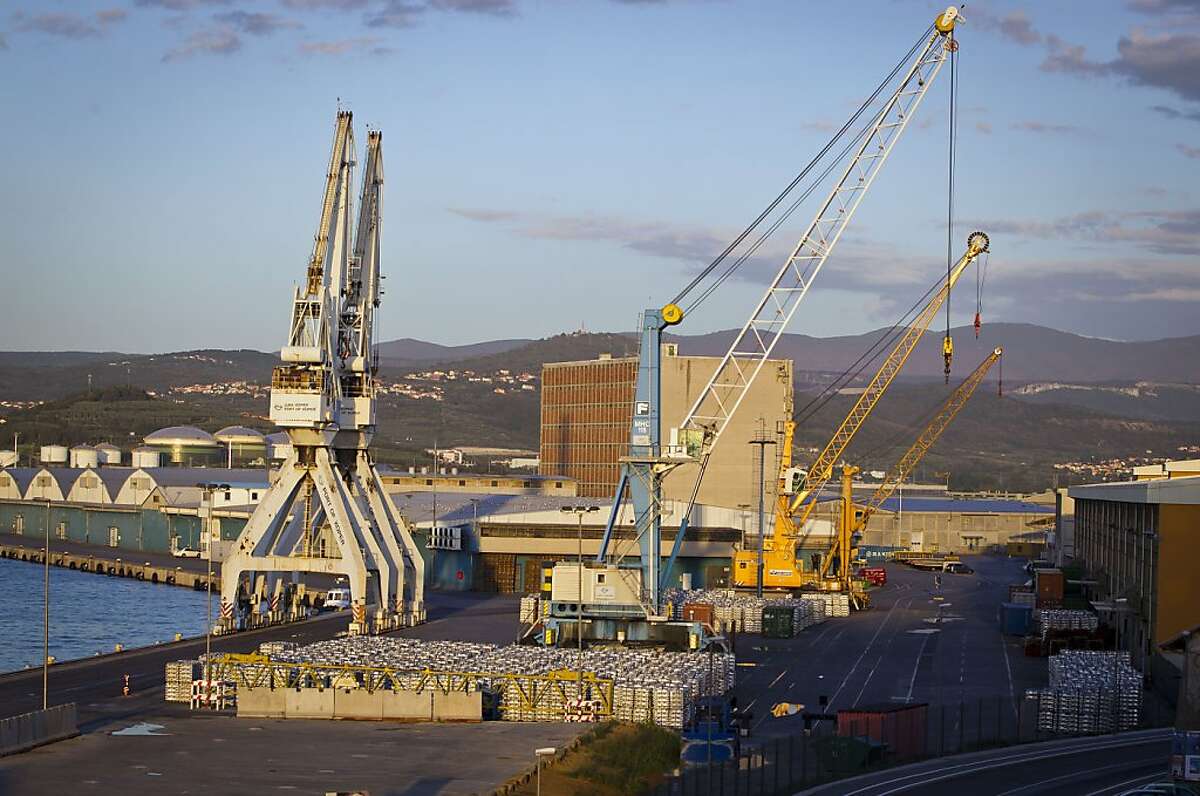 Cranes are seen in the port of Koper, Slovenia, Tuesday, Sept. 25, 2012. Once the envy of the former European communist states because of its booming economy and Western-style living standards, Slovenia is becoming a showcase of failed transition, government mismanagement and bad loans. Andrej Plut has always thought he was fortunate to live in Slovenia, at one time the most prosperous of the former republics of Yugoslavia and a star among the eastern European states that joined the EU after the fall of communism. The 55-year-old dentist can't figure out what went wrong with his tiny Alpine state, which now faces one of the worst recessions and financial system collapses among the crisis-stricken 17-country group that uses the euro. "We used to live so well," Plut said. "Now, we don't know what tomorrow brings." (AP Photo/Darko Bandic)