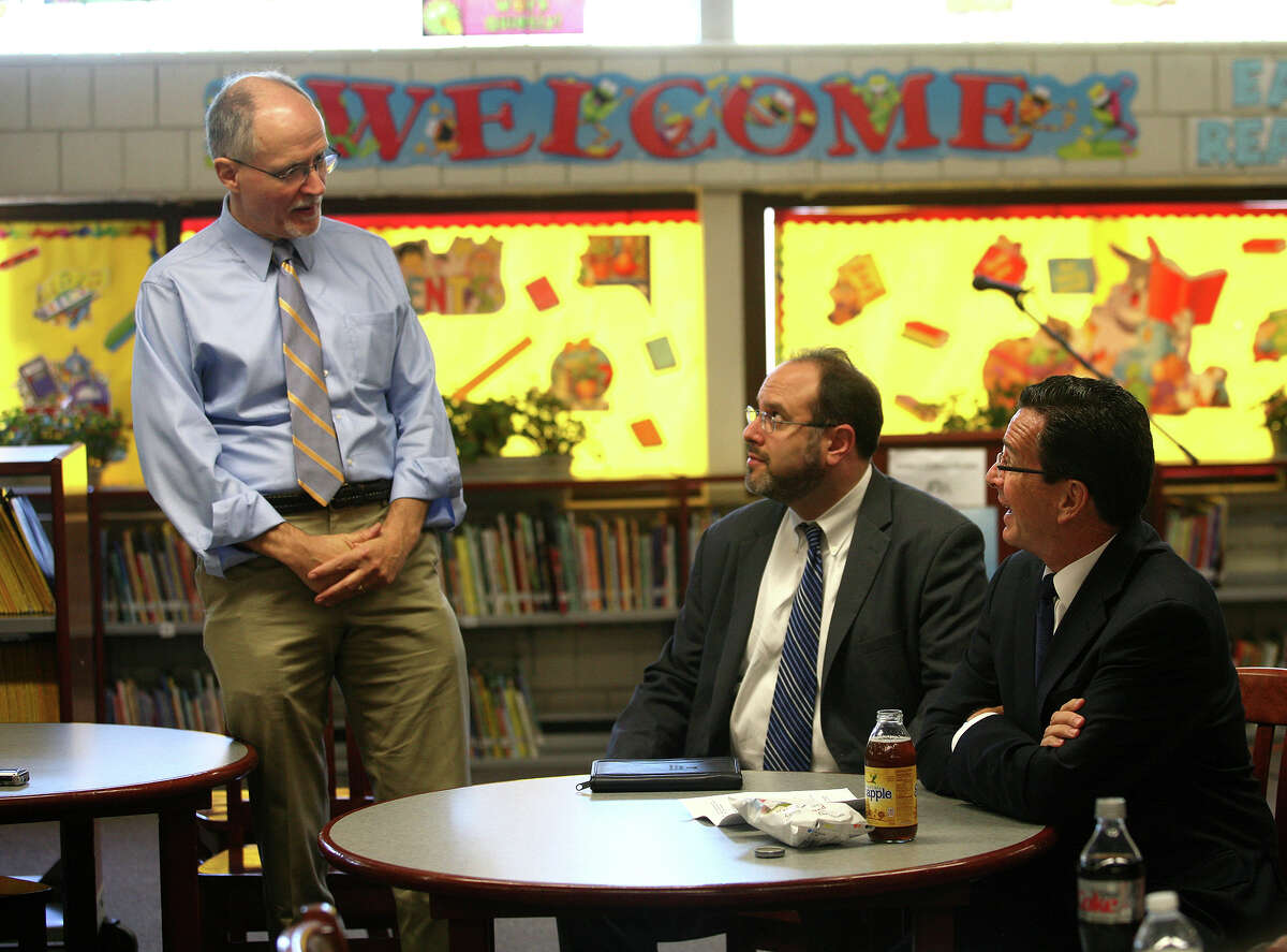 From left; Bridgeport Supt. of Schools Paul Vallas, Commissioner of Education Stefan Pryor, and Gov. Dannel P. Malloy chat during the governor's visit to Curiale School in Bridgeport on Tuesday, October 16, 2012.