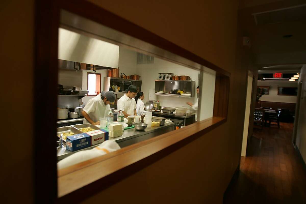 RANGE: From the middle room, Range Restaurant includes a window view of the kitchen.