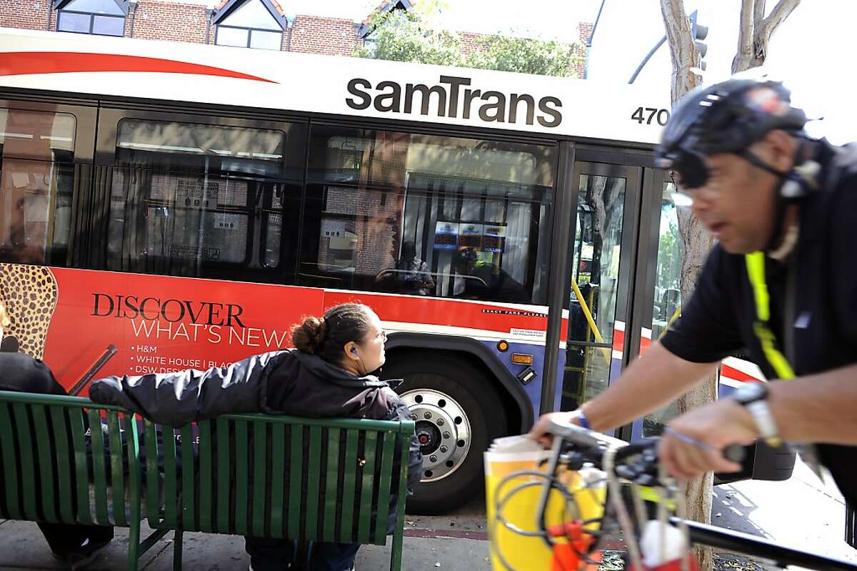Passengers are seen waiting for an off duty SamTrans bus on 1st Ave. and B St. in downtown San Mateo, CA, Tuesday, October 10th, 2012