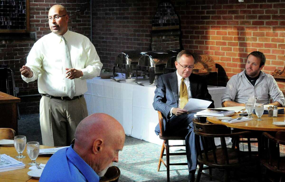 Civic leaders, including Jason Bartlett, left, and state Sen. Andrew Maynard, right center, discuss bringing greater rail transportation to Connecticut during a meeting in Danbury Thursday, Oct. 18, 2012.