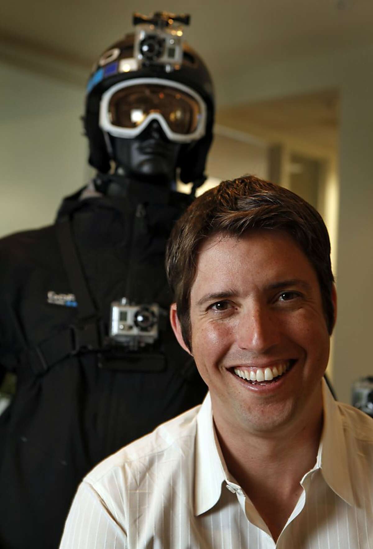 GoPro, Founder and CEO Nicholas Woodman is surrounded by dozens of variations of his GoPro cameras that are used by both pro and amateur photographers specializing is sports and recreation photography at his Half Moon Bay office Wednesday May, 4, 2011