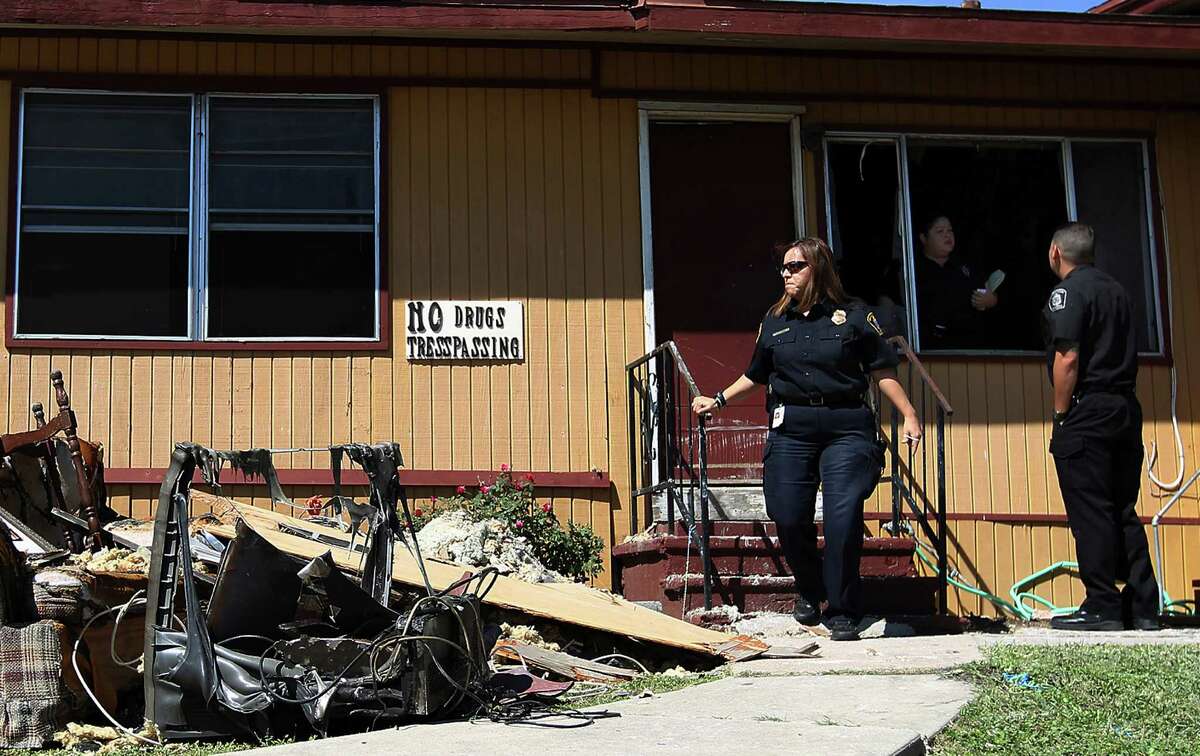 City code enforcement officials survey the aftermath of the fire. Damage to the structure was estimated at $25,000. Facility owner Linda McFadden said the seven residents have been relocated.