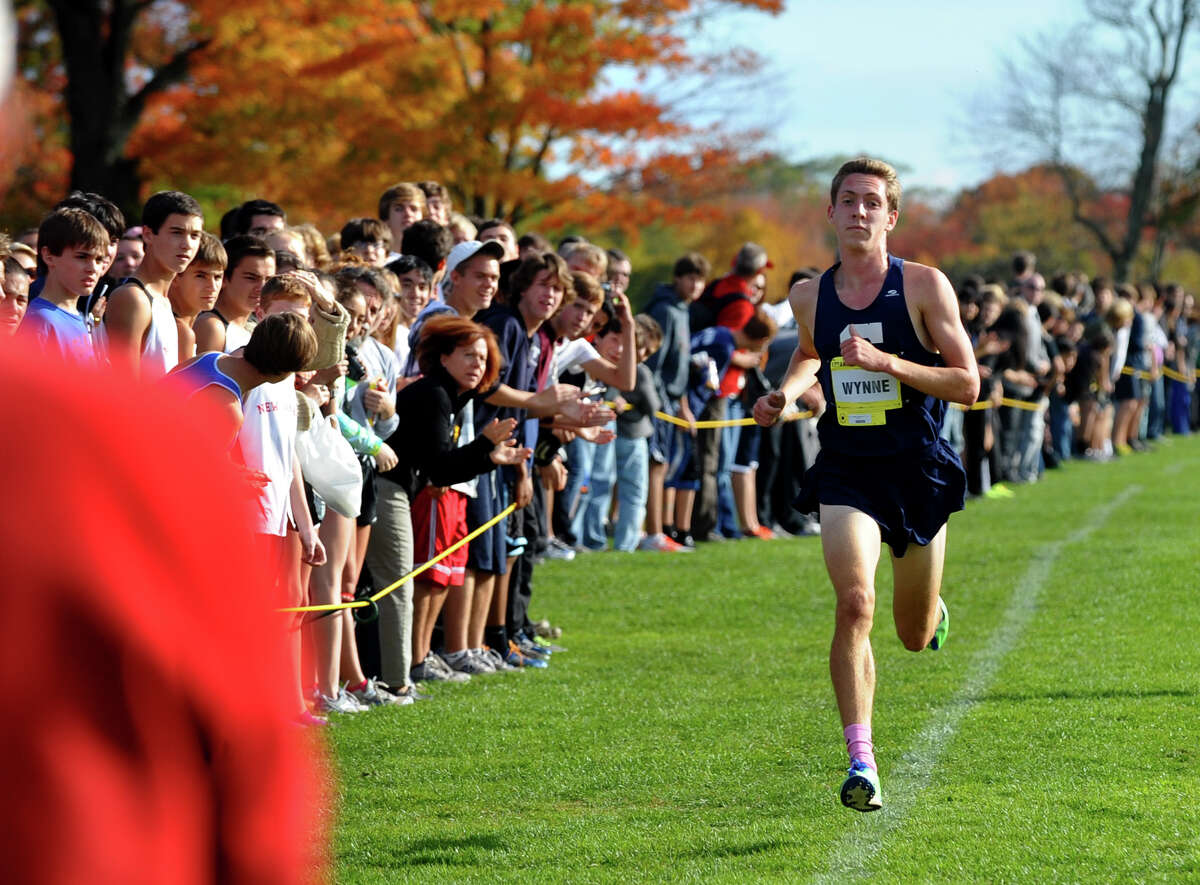 Staples' Henry Wynne cruises towards the finish line for first place, during boys FCIAC cross country action at Wavenly Park in New Canaan, Conn. on Thursday October 18, 2012.