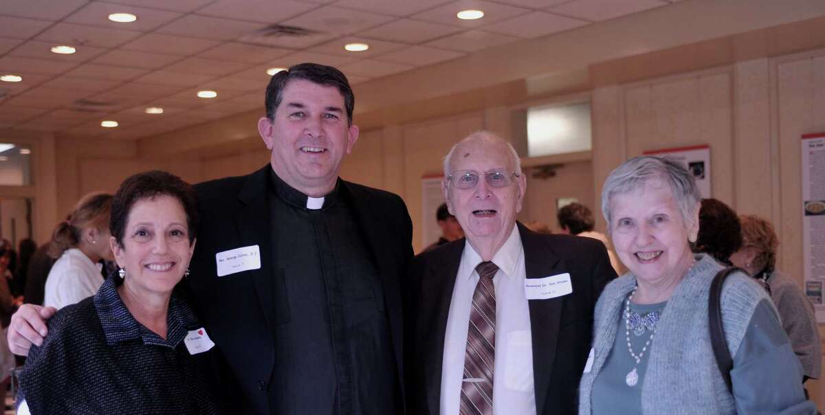 Ellen Umansky and The Rev. George Collins of Fairfield University, left, stand with Reverends Don and Arlene Studer, retired clergy from First Church Congregational, during a recent sukkot luncheon at Congregation Beth El to benefit Fairfield homeless shelter Operation Hope. Collins gave the invocation for the luncheon held on Thursday, Oct. 4.