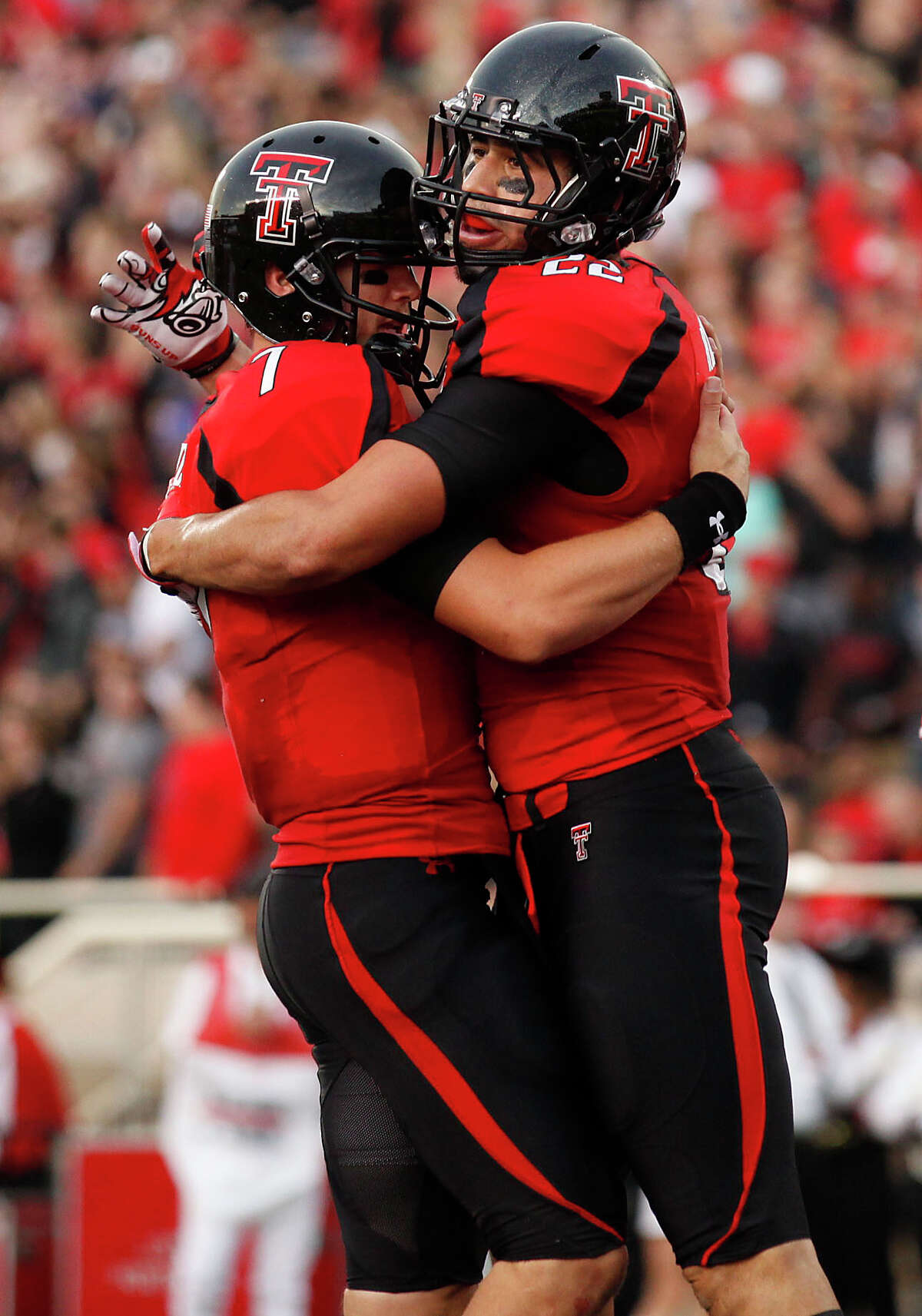 Texas Tech's Seth Doege (7) and Jace Amaro (22) celebrate a touchdown against New Mexico during an NCAA college football game in Lubbock, Texas, Saturday, Sept. 15, 2012. (AP Photo/Lubbock Avalanche-Journal, Stephen Spillman) Texas Tech