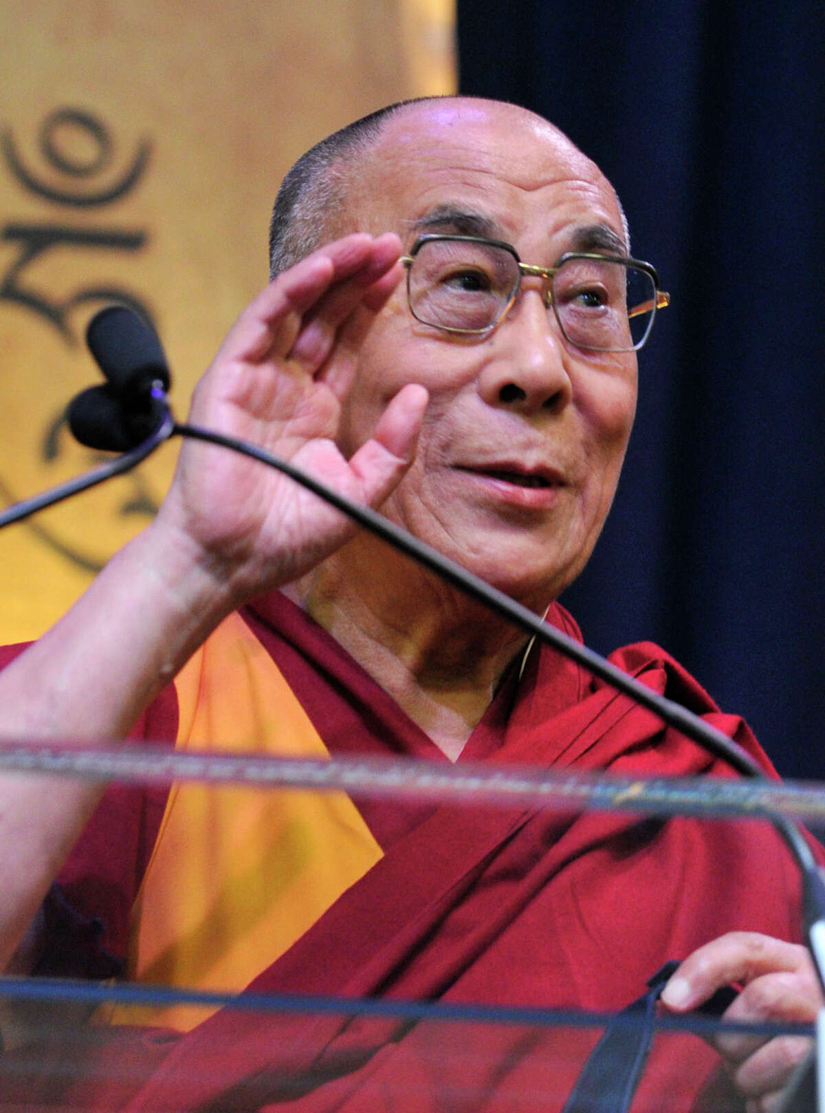The Dalai Lama speaks to a crowd at the O'Neill Center on Western Connecticut State University's west side campus during his "The Art of Compassion" speech in Danbury on Thursday, Oct. 18, 2012.