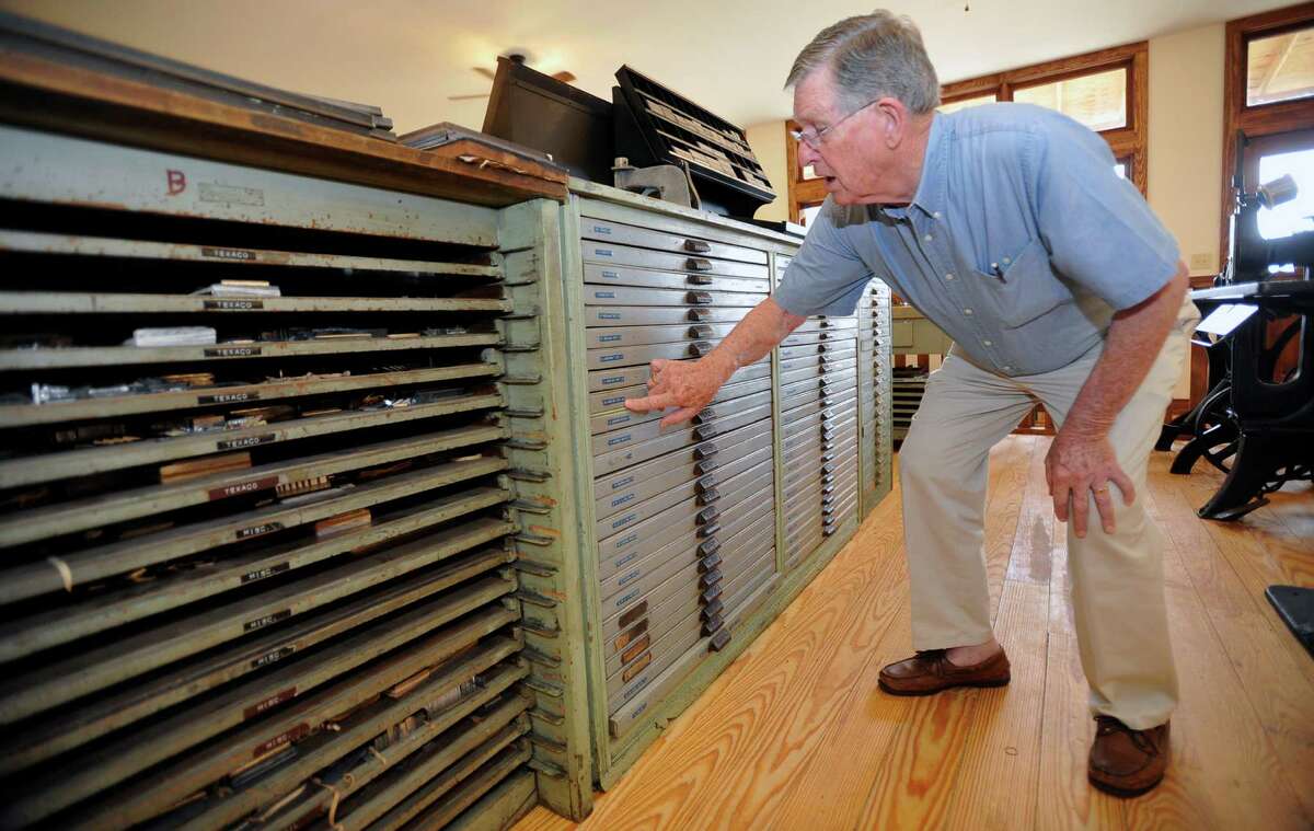 Tom Lamb, right, talks about all that it took to pull all this stuff out of storage and move it to it's new location at the Spindletop-Gladys City Boomtown Museum. These drawers contain lead type in all different fonts and point sizes. In the late 1800s, the Lamb family opened a printing shop on the sidewalk in the heart of downtown Beaumont. They helped start and print the Beaumont Enterprise, and officially opened Lamb's Printing Company in 1895. Tom Lamb, the last president of the family business, preserved a full set of printing and type setting machines which will be on display beginning Oct. 27 at the Gladys City Boomtown Museum. Dave Ryan/The Enterprise