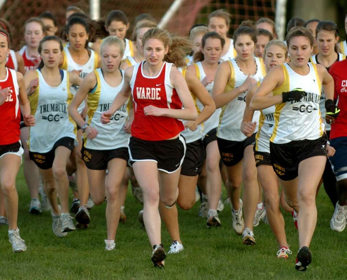 Fairfield Warde's Meg Ryan, center, leads the pack at the start of the girls cross country event at Trumbull High in Trumbull, Conn. on Tuesday Oct. 13, 2009.