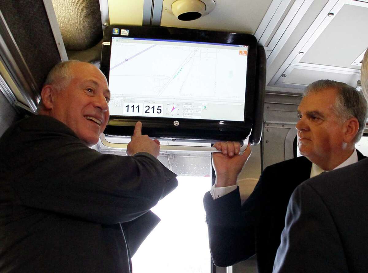 Illinois Gov. Pat Quinn, left, points out the speed of the Amtrak train that he and US Transportation Secretary Ray LaHood are riding as it reaches 111 mph on a test run between Dwight and Pontiac, Ill., Friday, Oct. 19, 2012, in Pontiac, Ill. (AP Photo/Charles Rex Arbogast)