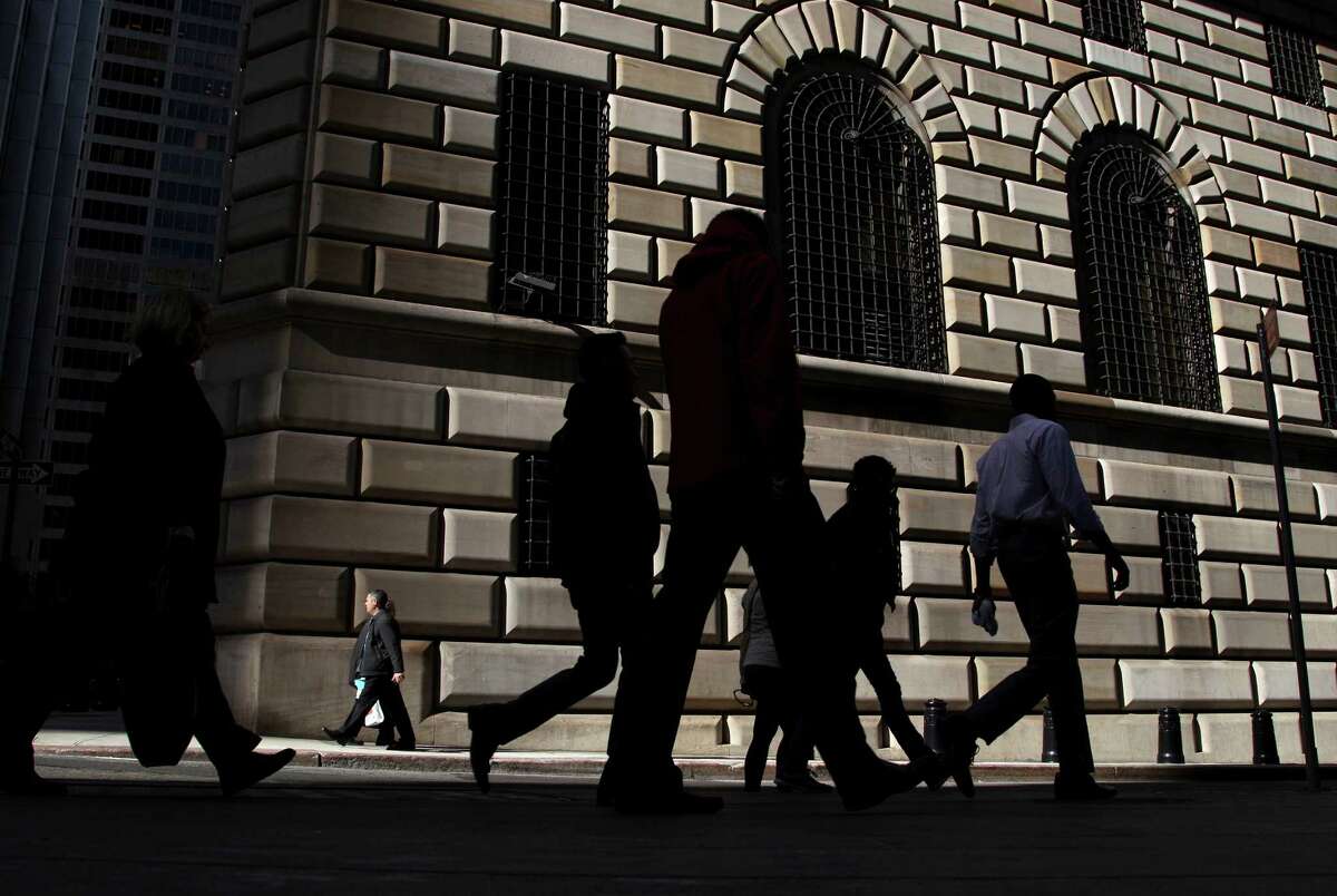 Pedestrians walk past the Federal Reserve Bank of New York in New York, Thursday, Oct. 18, 2012. A Bangladeshi man snared in an FBI terror sting on Wednesday considered targeting President Barack Obama and the New York City Stock Exchange before settling on a car bomb attack on the Federal Reserve, just blocks from the World Trade Center site, a law enforcement official told The Associated Press on Thursday. (AP Photo/Seth Wenig)