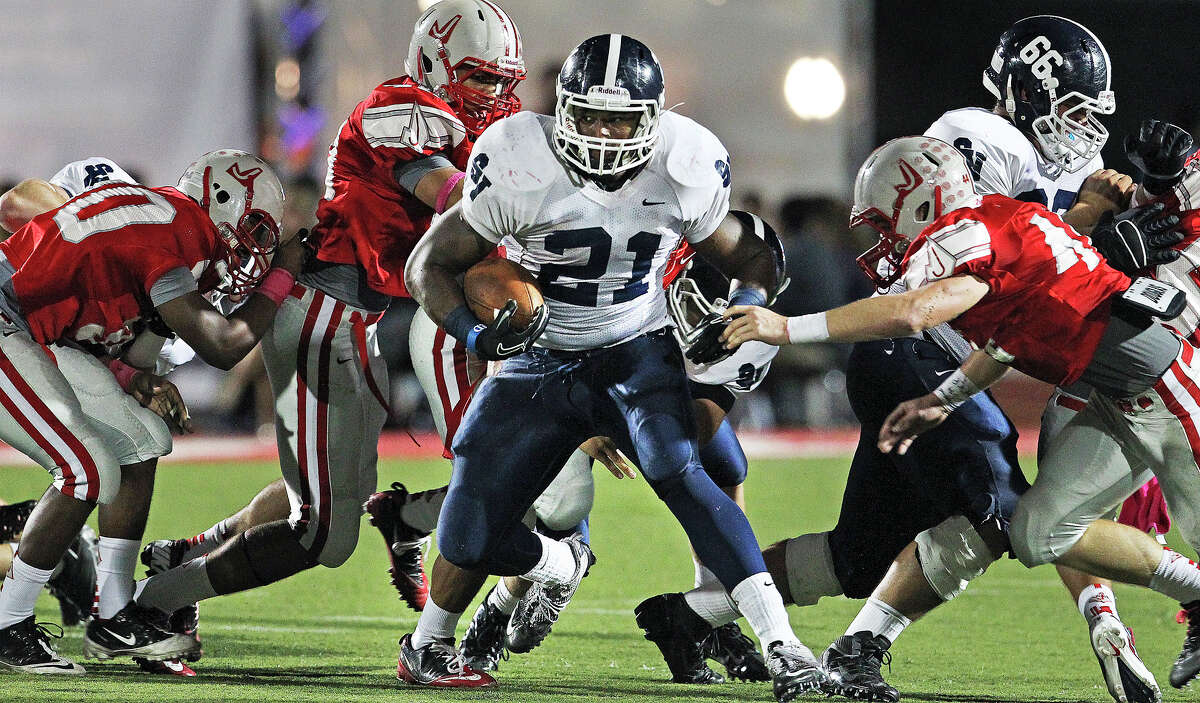 Lawrence Mattison rambles through the middle of the Rocket defense as Judson hosts Smithson Valley at Rutledge Stadium on October 19, 2012.