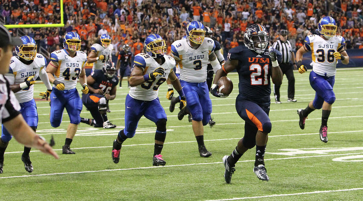 UTSA's Evans Okotcha (21) sprints to a 69-yard touchdown against San Jose State in the first half at the Alamodome on Saturday, Oct. 20, 2012.