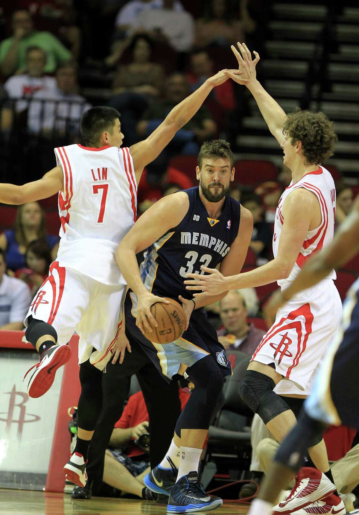 It's not ballet; it's defense the Rockets' Jeremy Lin, left, and Omer Asik play on the Grizzlies' Marc Gasol. Coach Kevin McHale values such defense in the paint.
