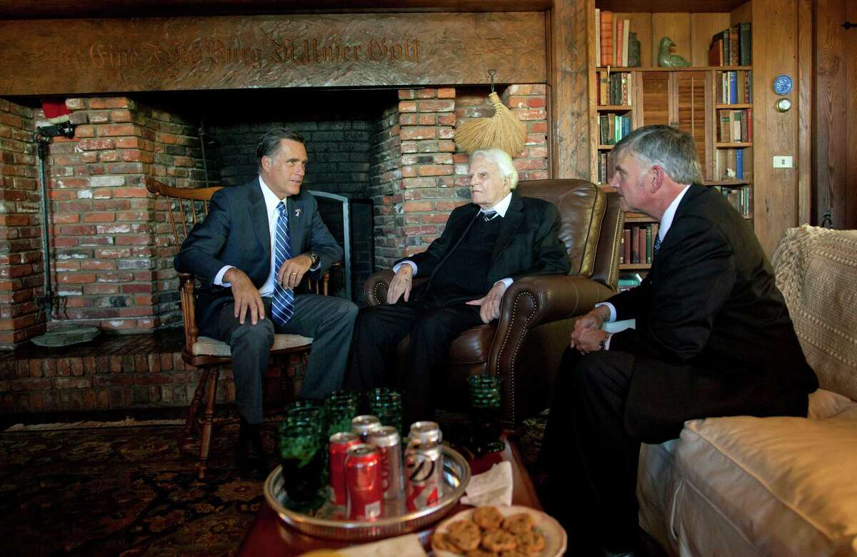 Republican presidential candidate Mitt Romney meets with Rev. Billy Graham, center, and his son Franklin Graham. Despite religious differences, the Grahams are backing Romney.