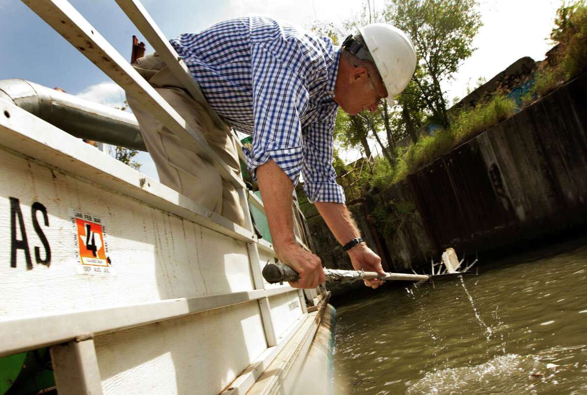 Mike Garver, known fondly as the Trashman of Buffalo Bayou, can often be found spearing plastic bottles and beer cans from the waterway in Houston.