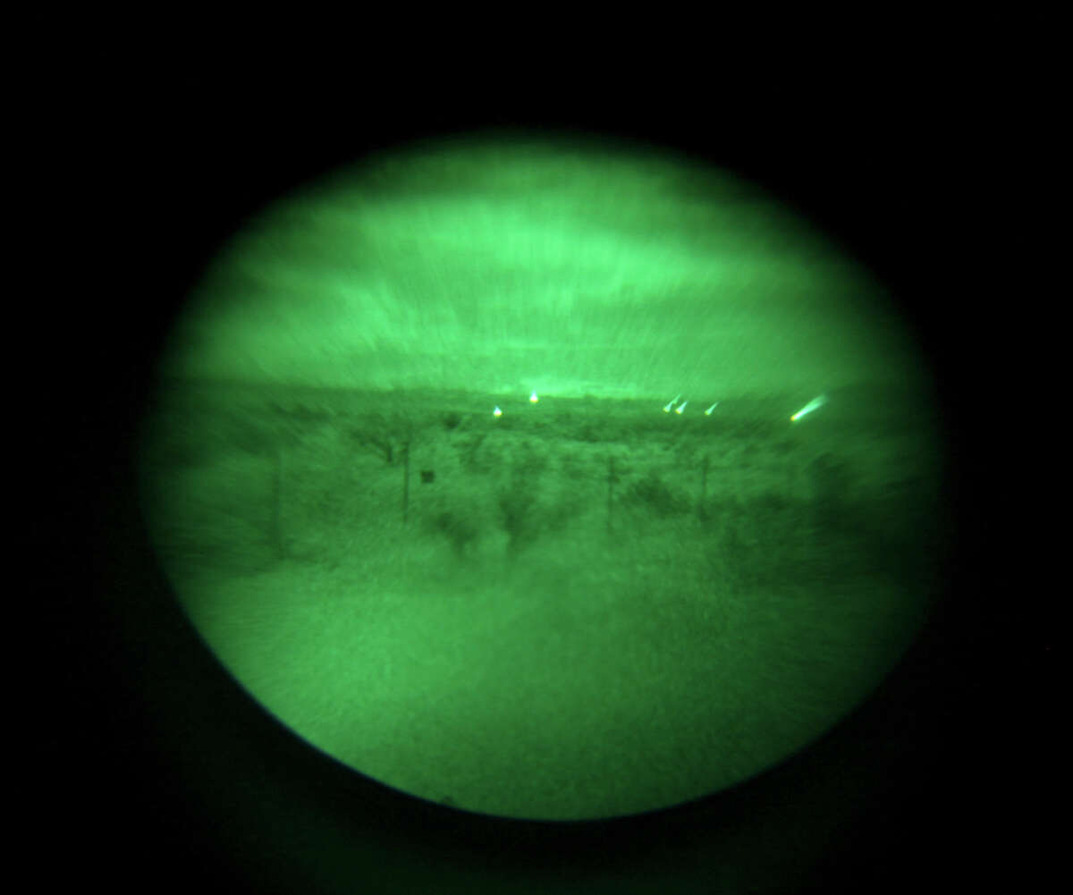 A view of the radio tower light (left) and Marfa Lights through a night-vision monocular on Saturday Oct. 20, 2012 at the Marfa Lights Viewing Area, nine miles east of Marfa, Tx.