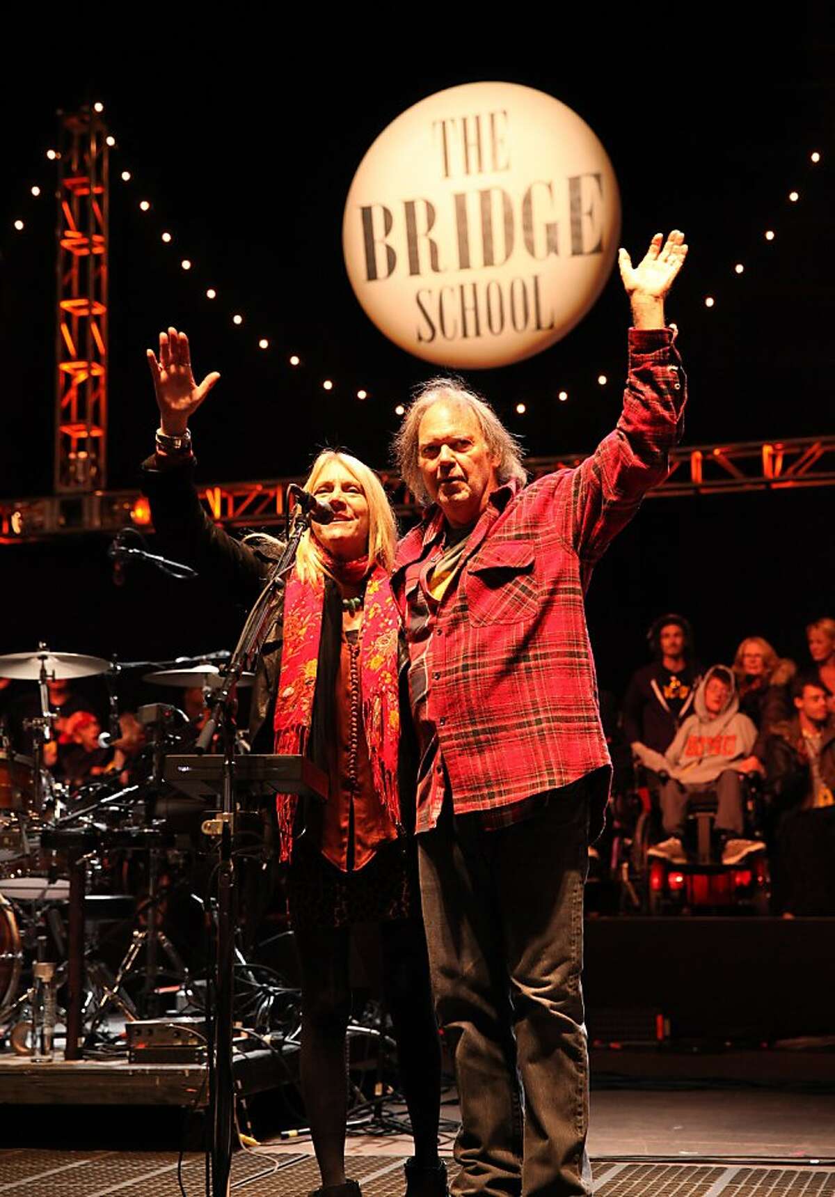 Pegi Young and Neil Young say good night at the Bridge School Benefit Concert at the Shoreline Amphitheatre on Saturday, Oct. 20, 2012, in Mountain View, Calif. 