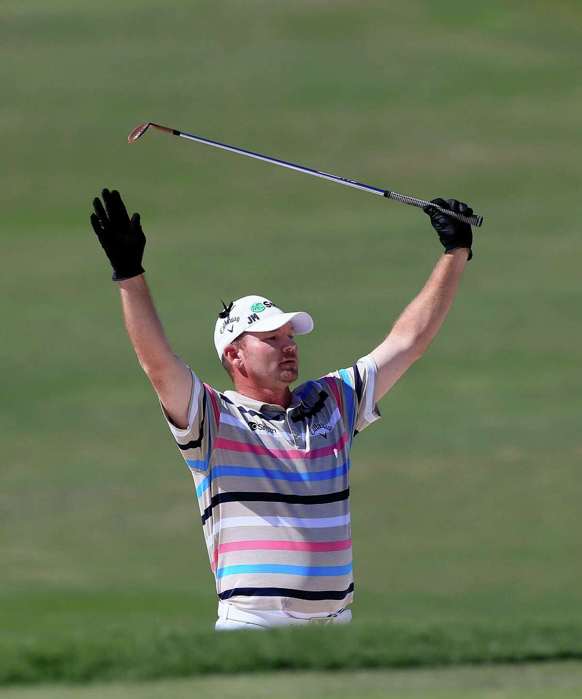 Tommy Gainey became known for more than his unusual habit of wearing two gloves when he shot a 60 on Sunday, highlighted by an eagle from a bunker on the 15th hole, to finish off his first PGA Tour win.