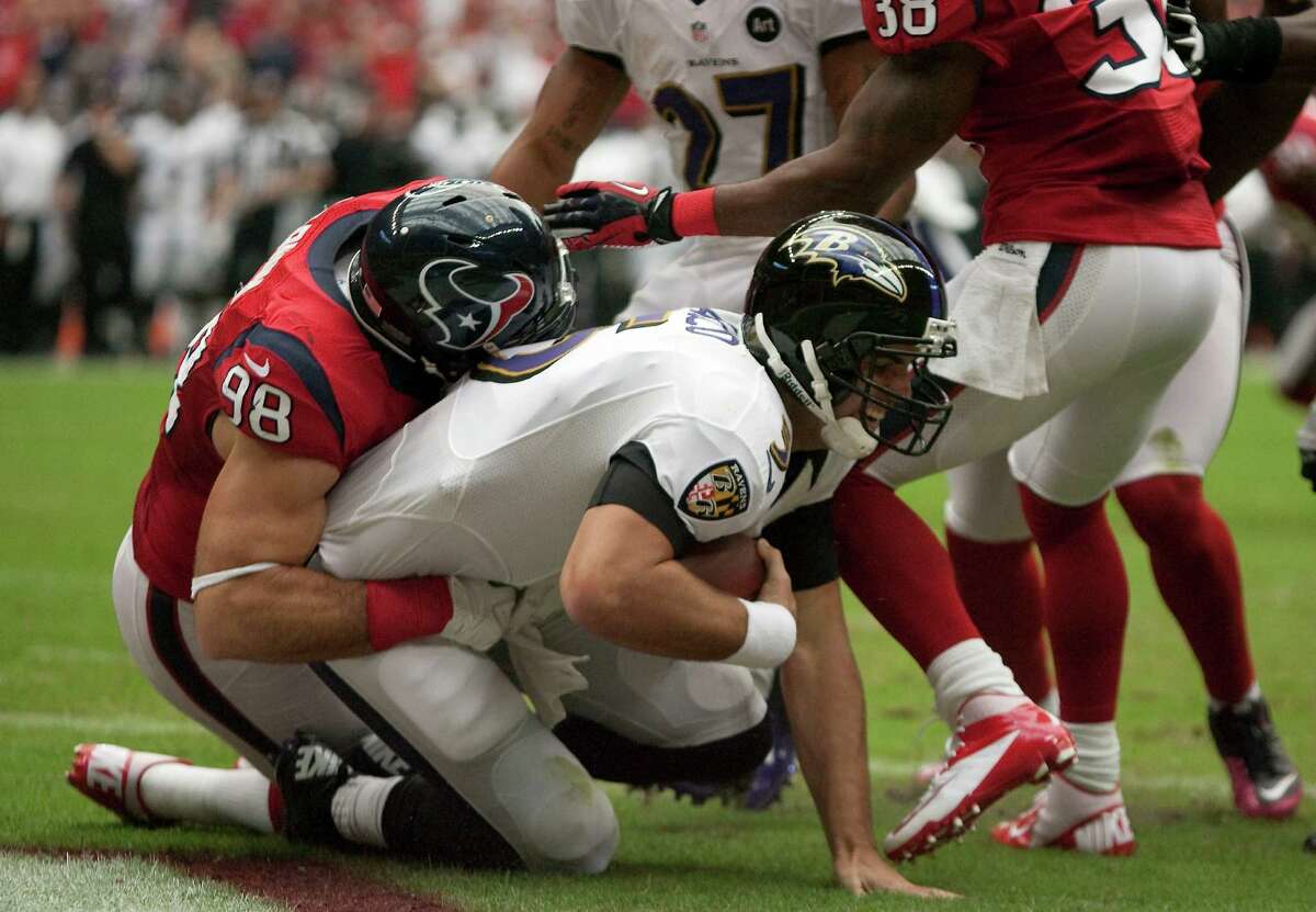 Texans outside linebacker Connor Barwin inflicts some of his pain on Ravens quarterback Joe Flacco. The sack, which resulted in a safety, was Barwin's first of the season, ending a frustrating drought that came on the heels of his 111/2-sack campaign last year.