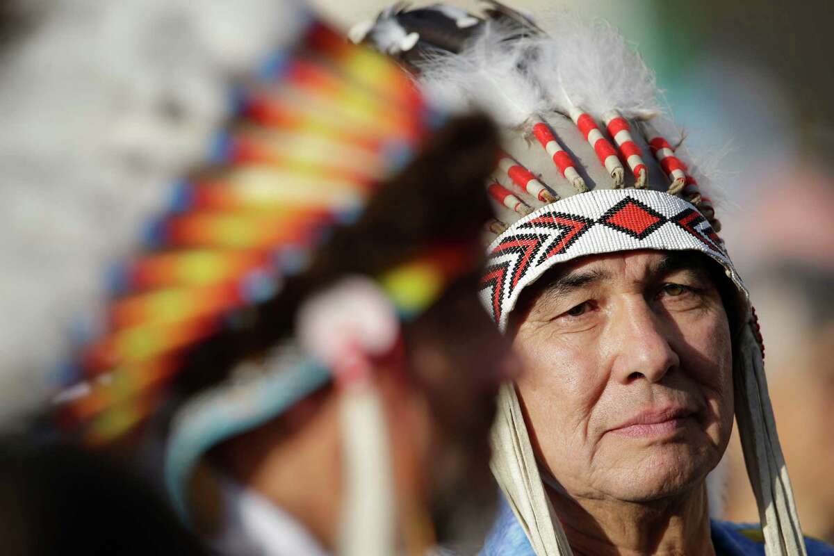 Native Indians wait for the start of a canonization ceremony celebrated by Pope Benedict XVI, in St. Peter's Square, at the Vatican, Sunday, Oct. 21, 2012. The pontiff will canonize seven people, Kateri Tekakwitha, the first Native American saint from the U.S., Maria del Carmen, Pedro Calungsod, Jacques Berthieu, Giovanni Battista Piamarta, Mother Marianne Cope, and Anna Shaeffer. (AP Photo/Andrew Medichini)