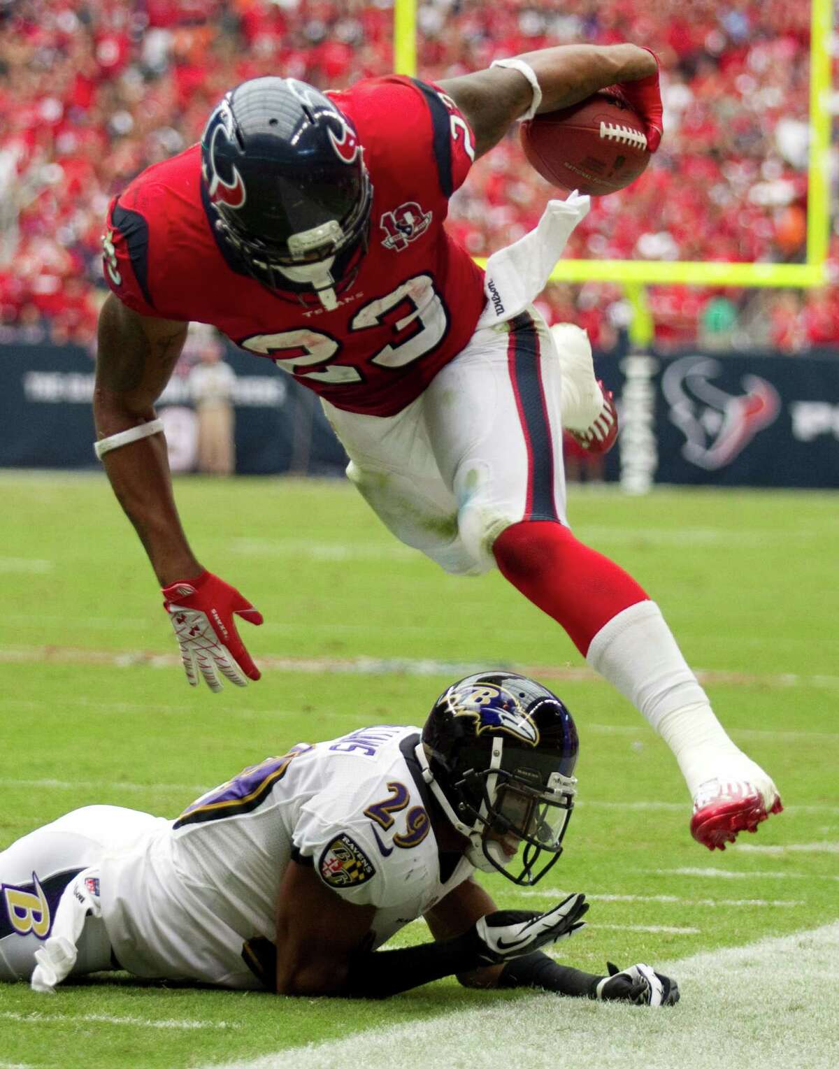 Texans running back Arian Foster eluded Ravens defenders like cornerback Cary Williams (29) all day on his way to 98 yards rushing in the Texans' win Sunday.