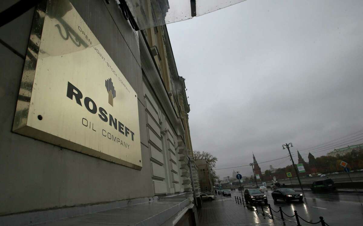 FILE - In this Oct. 18, 2012 file photo, a plaque of Rosneft is seen outside its headquarters in Moscow, Russia. British oil company BP says it has agreed to sell its stake in its TNK-BP joint venture to Russian oil company Rosneft for US$17.1 billion in cash and a 12.84 percent stake in Rosneft. BP announced Monday, Oct. 22, 2012, that it would use some of the money to buy more shares in Rosneft to raise its stake to 19.75 percent. (AP Photo/Mikhail Metzel)