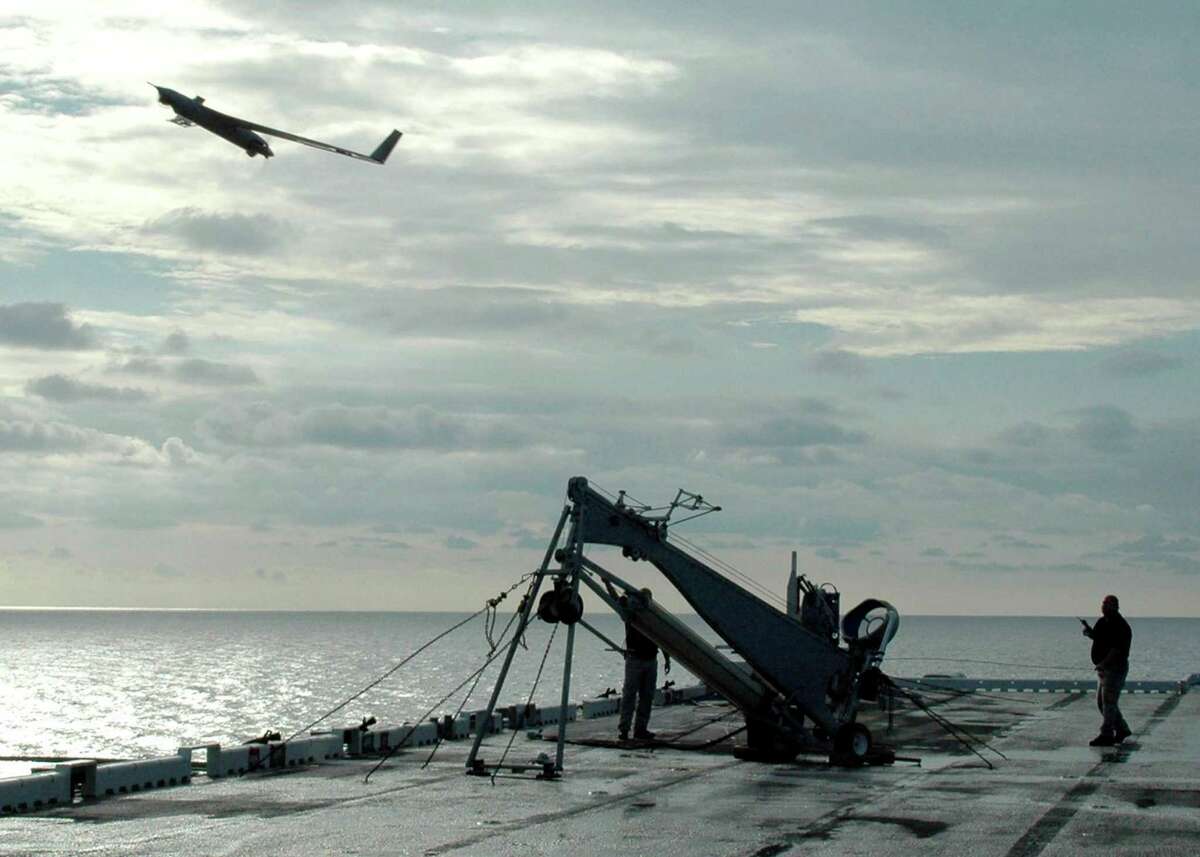In this handout provided by the U.S. Navy, a Scan Eagle unmanned aerial vehicle launches from the flight deck of the amphibious assault ship USS Saipan on August 18, 2006 in the Atlantic Ocean.