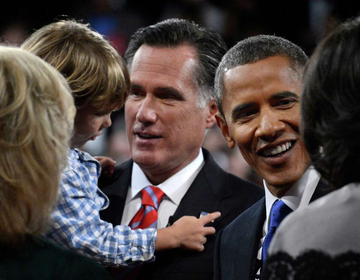 President Barack Obama and Republican presidential nominee Mitt Romney meet family members after the third presidential debate at Lynn University, Monday, Oct. 22, 2012, in Boca Raton, Fla. (AP Photo/Pool-Michael Reynolds)