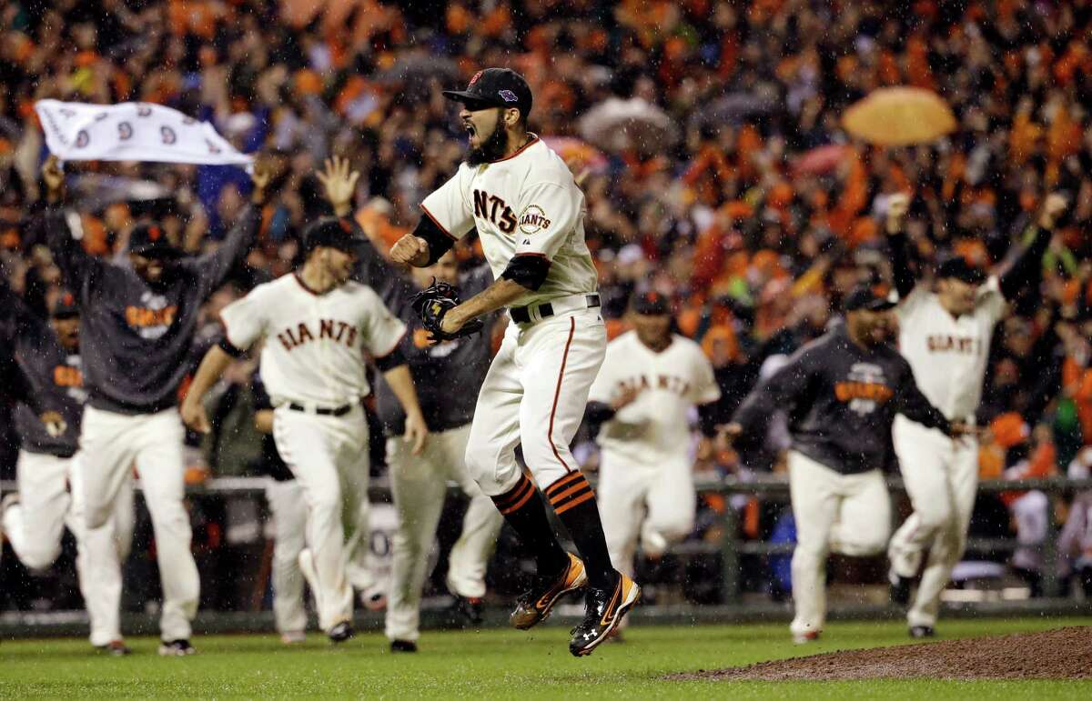 The AT&T Park crowd erupts and the dugout empties after closer Sergio Romo gets the final out to advance the Giants to the World Series, where San Francisco will play the Detroit Tigers for the first time in the postseason.