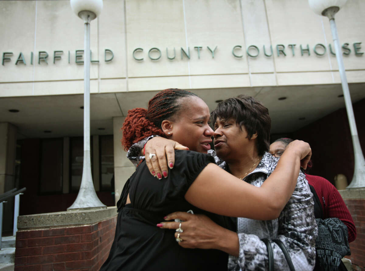 Carlonetta McAllister, left, and Martha McAllister, of Florence, South Carolina, sister and mother of Frederick McAllister, console each other outside Superior Court on Main Street in Bridgeport on Tuesday, October 23, 2012. The city and Bridgeport police Lt. Brian Fitzgerald were cleared of civil wrongdoing in the shooting of McAllister on January 31, 2008. McAllister was shot in the back by Fitzgerald during a police chase.
