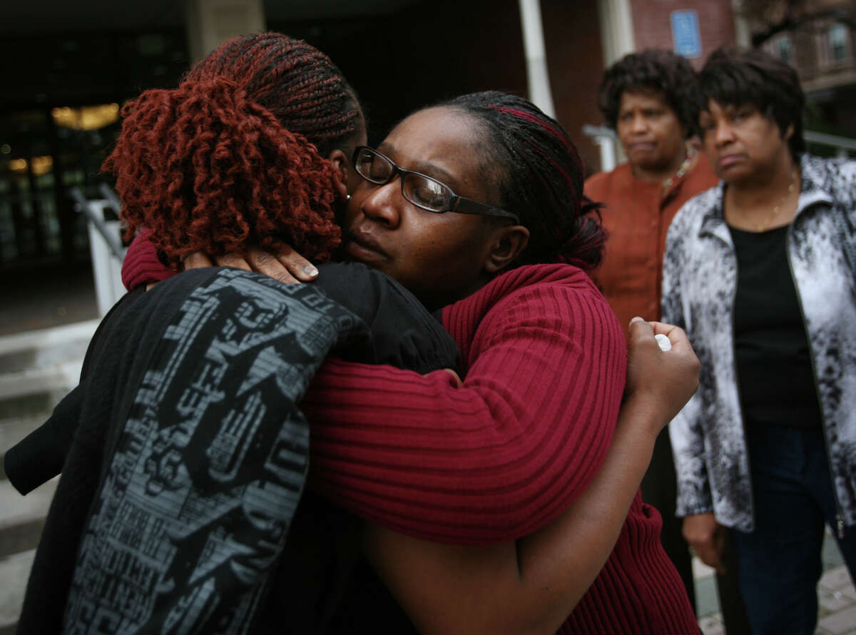 From left; Carlonetta McAllister, Adrienne Williams, Margaret Williams, and Martha McAllister, all of Florence, South Carolina, sister, cousin, aunt, and mother of Frederick McAllister, console each other outside Superior Court on Main Street in Bridgeport on Tuesday, October 23, 2012. The city and Bridgeport police Lt. Brian Fitzgerald were cleared of civil wrongdoing in the shooting of McAllister on January 31, 2008. McAllister was shot in the back by Fitzgerald during a police chase.