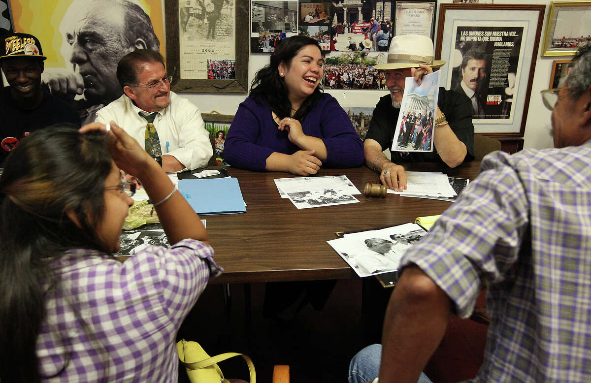 Benita Veliz (center) shares a laugh with Cesar Chavez Legacy and Educational Foundation CEO Jaime Martinez (right) and instructor and coordinator Joseph Fonseca, Jr. (left) during a meeting at the foundation on Tuesday, Oct. 23, 2012. Veliz came into the spotlight of immigration and the Dream Act when she was discovered living most her life in the U.S. illegally. Since then she has been an advocate for the Dream Act which provides a way for immigrants like herself to gain citizenship instead of deportation. A recent study shows that the passage of the Dream Act could generate $66 billion for the Texas economy.
