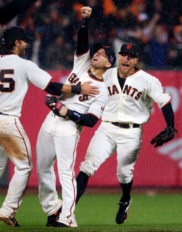 9. Marco Scutaro in the rain — the indelible image from the 2012 San Francisco Giants' NLCS victory over the St. Louis Cardinals. The Giants rallied back from down three games to one, clinching a spot in the World Series with a rainy 9-0 victory at home. Photo: Randy Pench / Associated Press / The Sacramento Bee