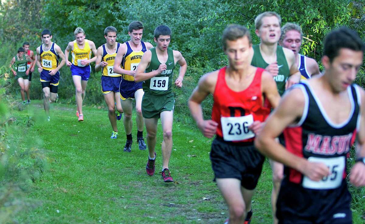 Among those ascending Bethel High School's fabled "Beast" during the South-West Conference boys' cross country meet are the Green Wave's Zach Guptill, amidst the pack at the right, Jay Humphreys (159) and, far left, Hugh Sichel. Oct. 18, 2012 Courtesy of Jim Carmellini