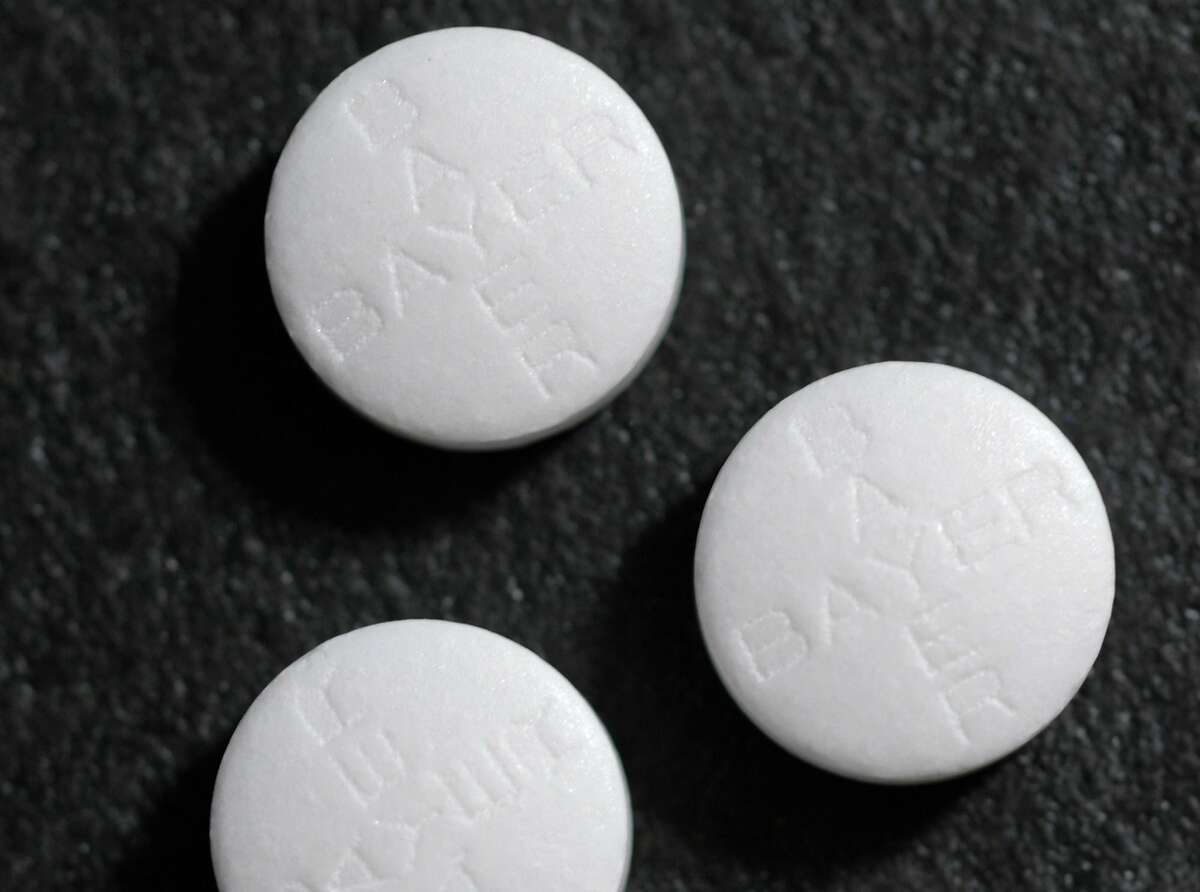 FILE - This May 25, 2004 file photo shows aspirin tablets. Aspirin, one of the world's oldest and cheapest drugs, has shown remarkable promise in treating colon cancer in people with certain genetic mutations that often play a role in the disease. The study appears in the Thursday, Oct. 25, 2012 New England Journal of Medicine.