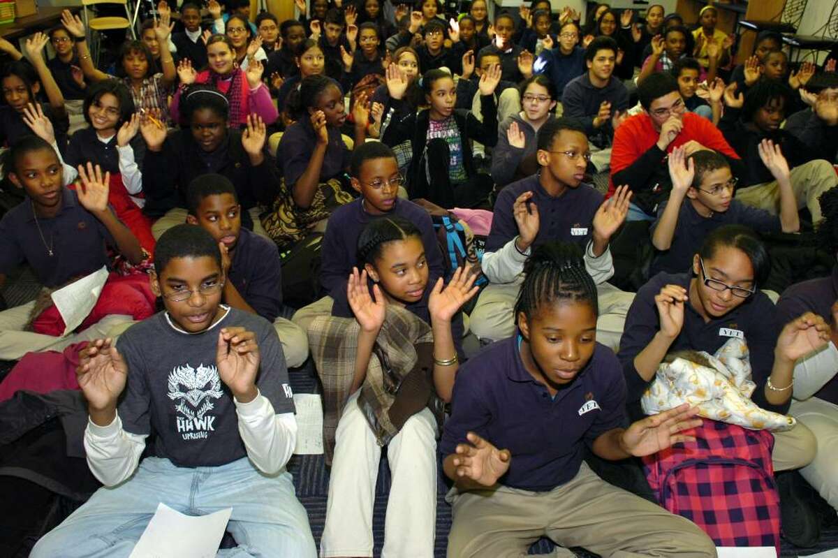 Students at Achievement First Bridgeport Academy cheer during a ceremony Friday, Dec. 11th, 2009, concluding the school's month long penny drive to raise money for 11 local charities and non-profit organizations.