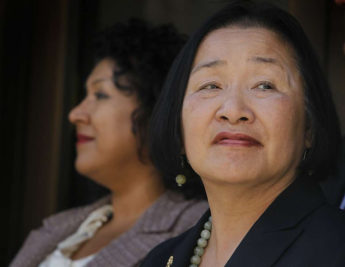 Oakland mayor Jean Quan appears at a news conference with city administrator Deanna Santana (left) to tout downtown Oakland's revitalization at a news conference on the steps of City Hall in Oakland, Calif. on Wednesday, Oct. 24, 2012. Thursday marks the one-year anniversary of the Occupy Oakland movement.